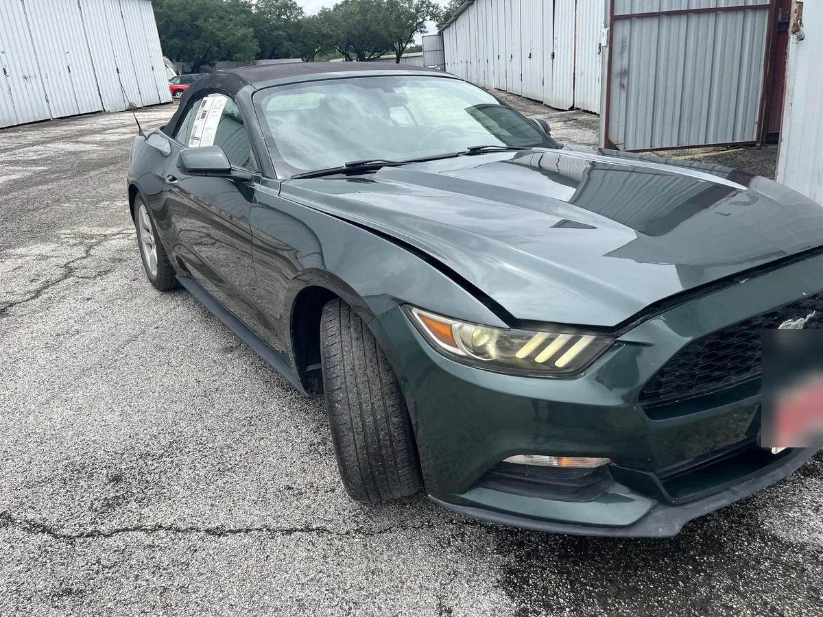 Dark green Ford Mustang convertible finished