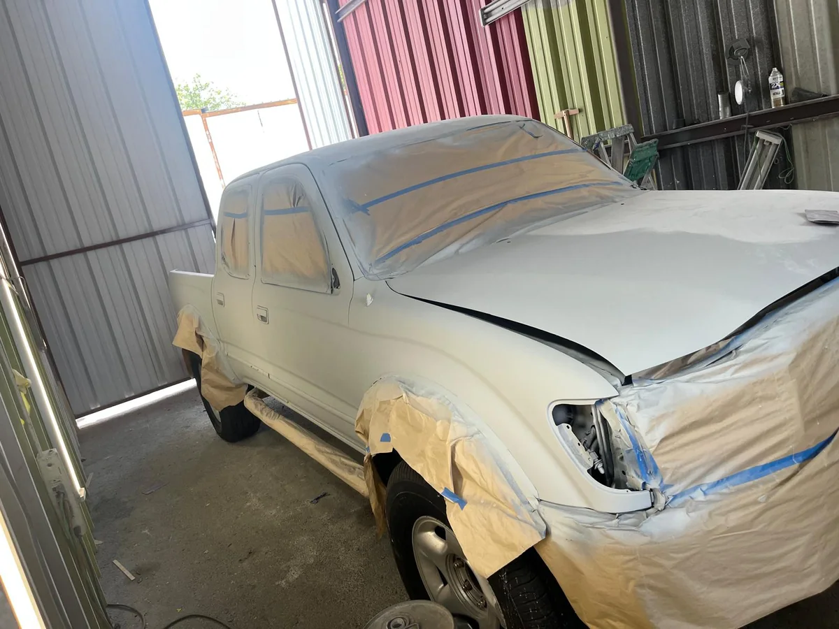Tacoma pickup in primer after bodywork on the front